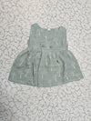 Grey green muslin baby jabla frock with white multi print and button design for 0–6 months.