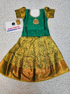 Green and mustard kids pattu pavadai set with puff sleeves and bridal silk skirt by Sri Thulir Tex
