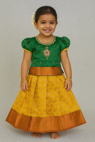 Green and mustard yellow silk pattu pavadai for girls with designer stone work blouse and zari leaf-patterned skirt – Sri Thulir Tex