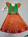 Kids pattu pavadai set with green semi silk top and orange bridal silk skirt by Sri Thulir Tex