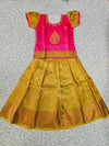 Kids pink and mustard gold pattu pavadai set with puff sleeves and zari woven silk skirt from Sri Thulir Tex