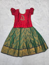 Kids red semi silk top with dark green bridal silk pattu pavadai set by Sri Thulir Tex