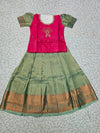 Kids pattu pavadai set with pink semi silk top and green bridal silk skirt by Sri Thulir Tex