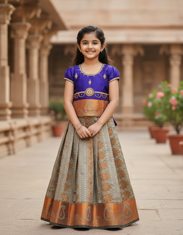 Kids Pattu Pavadai set with violet stone-work top and beige zari woven skirt from Sri Thulir Tex.