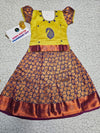 Kids pattu pavadai set with yellow semi-silk top and purple leaf patterned silk skirt by Sri Thulir Tex