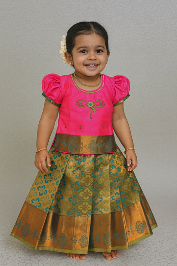 Pink and green silk pattu pavadai for girls with bow embroidery blouse and zari border skirt – Sri Thulir Tex