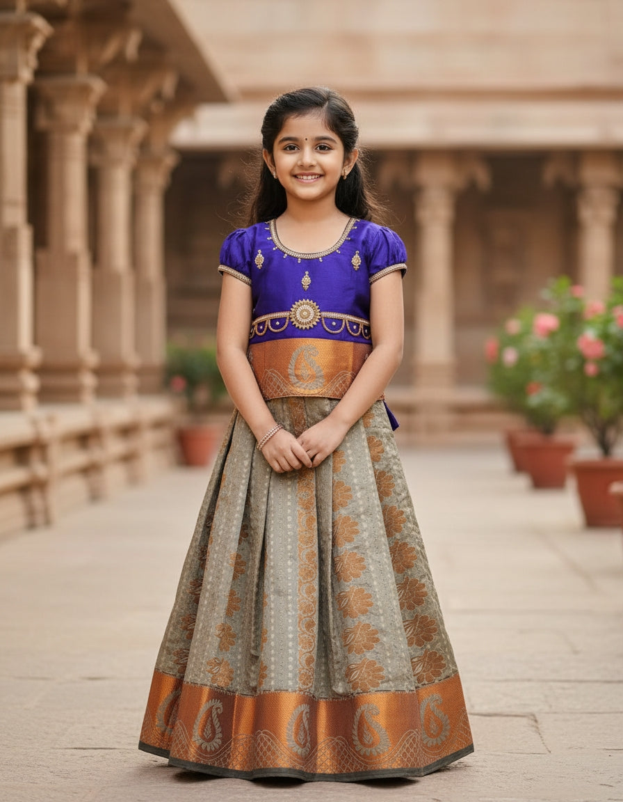 Royal Purple Kids Pattu Pavadai with Semi Silk Top and Bridal Silk Skirt featuring Puff Hand Design and Double Chain Neck Stone Work by Sri Thulir Tex.
