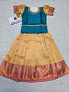 Teal blue and cream kids pattu pavadai set with puff sleeves and bridal silk skirt by Sri Thulir Tex