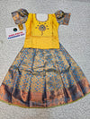 Yellow and blue kids pattu pavadai set with puff sleeves and bridal silk skirt by Sri Thulir Tex