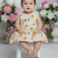 Cream muslin baby jabla frock with cute fruit and pineapple print, front open button style – Sri Thulir Tex