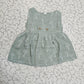 Grey green muslin baby jabla frock with white multi print and button design for 0–6 months.