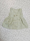 Light green muslin baby jabla frock with white multi print and button design for 0–6 months.