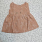 Baby muslin jabla frock in brown color with white multi print and button design for 0–6 months.
