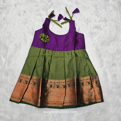 Pink top and green bridal silk baby frock with zari border by Sri Thulir Tex