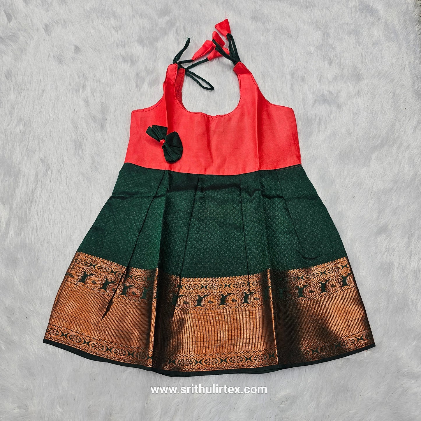 Pink top and green bridal silk baby frock with zari border by Sri Thulir Tex