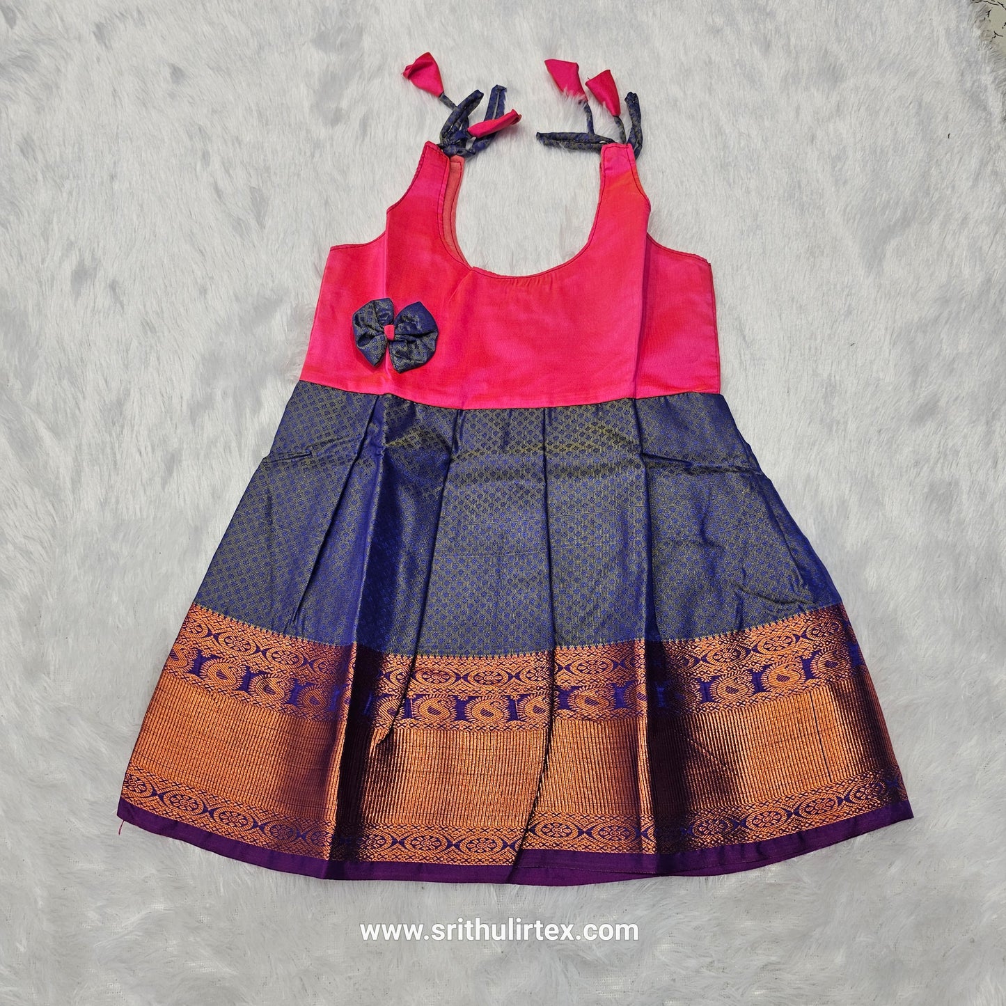 Pink top and green bridal silk baby frock with zari border by Sri Thulir Tex