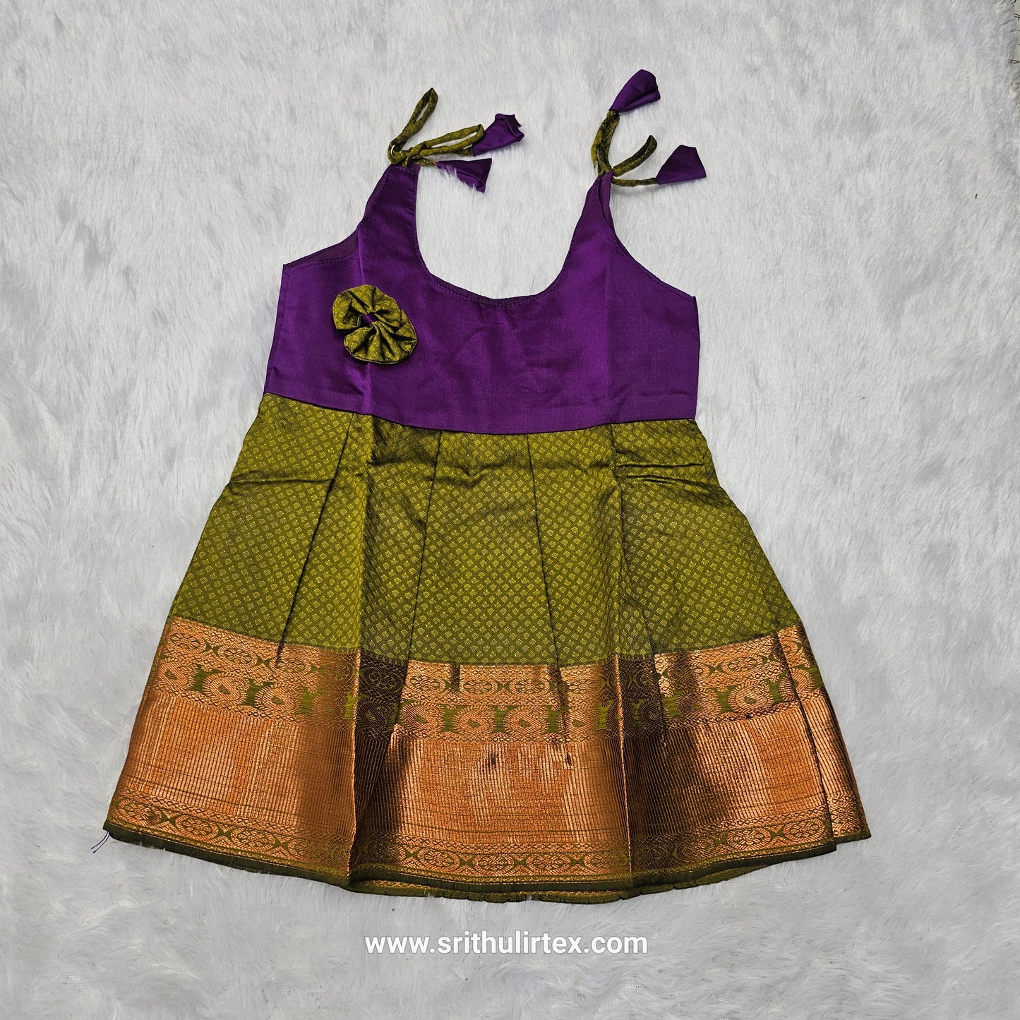 Pink top and green bridal silk baby frock with zari border by Sri Thulir Tex