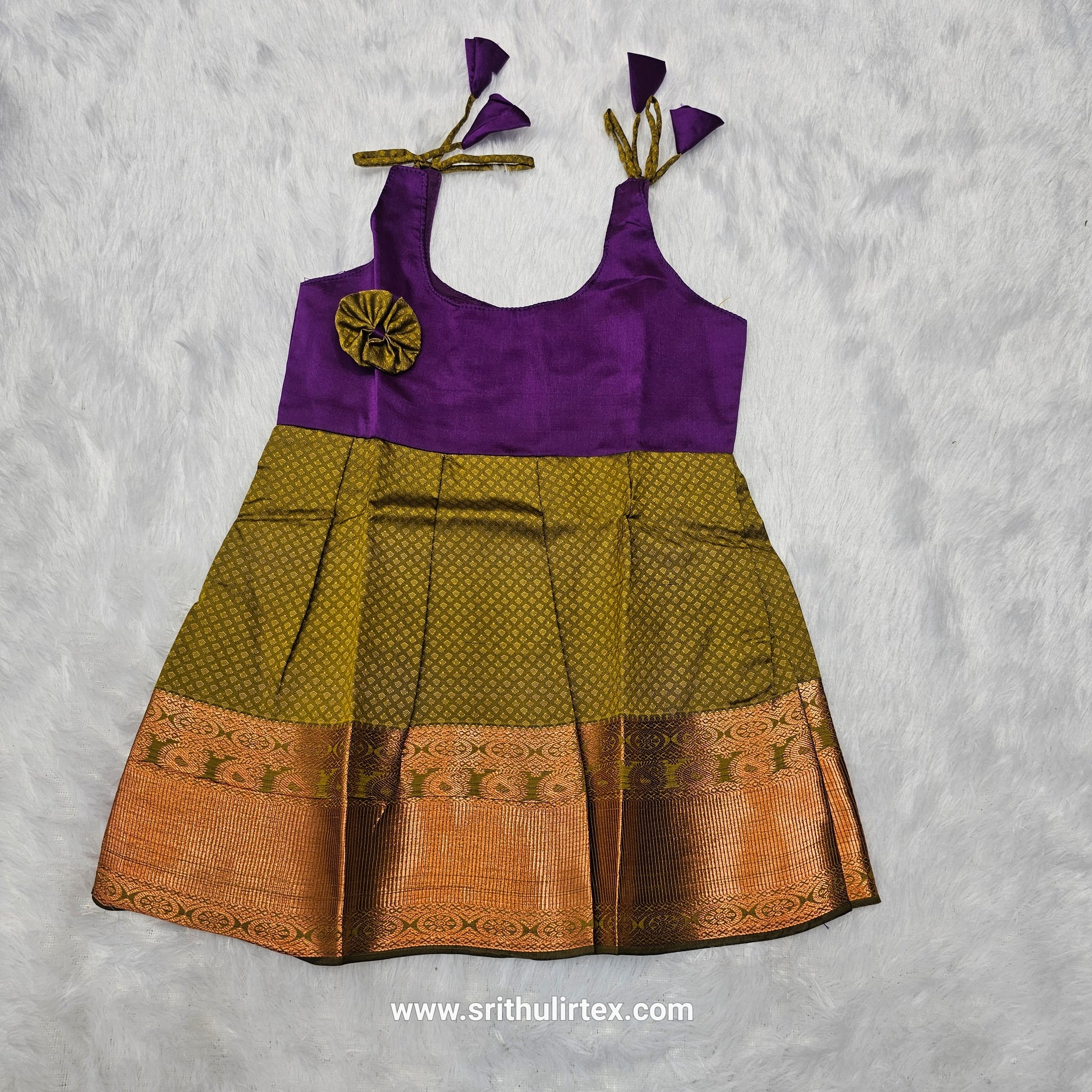 Pink top and green bridal silk baby frock with zari border by Sri Thulir Tex