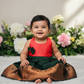 Pink top and green bridal silk baby frock with zari border by Sri Thulir Tex
