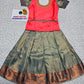 Coral pink and green kids pattu pavadai set with puff sleeves and zari bridal silk skirt by Sri Thulir Tex
