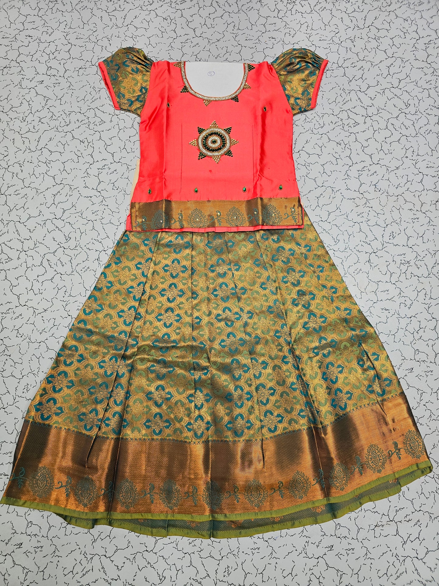Coral pink and green silk pattu pavadai for girls with stone work blouse and zari bridal silk skirt – Sri Thulir Tex