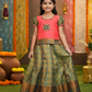Coral pink and green silk pattu pavadai for girls with stone work blouse and zari bridal silk skirt – Sri Thulir Tex