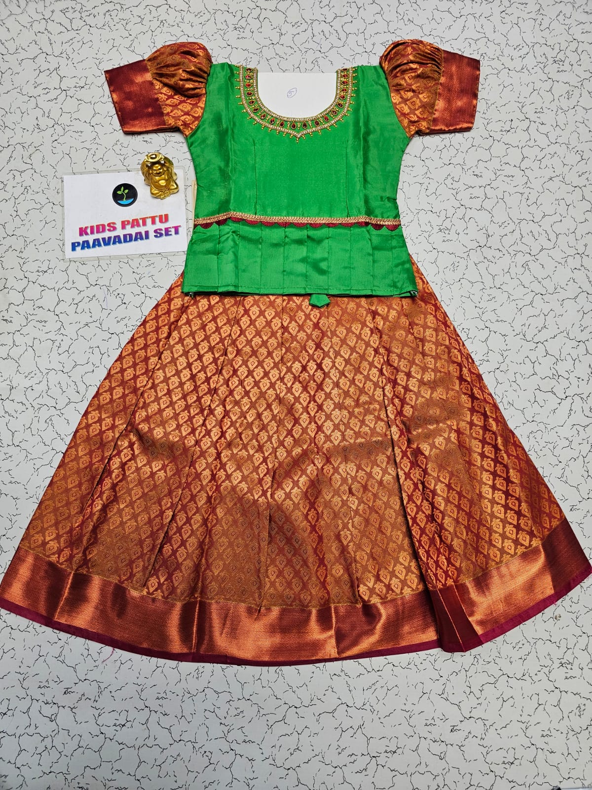 Green and copper kids pattu pavadai set with puff sleeves and bridal silk skirt by Sri Thulir Tex