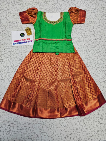 Green and copper kids pattu pavadai set with puff sleeves and bridal silk skirt by Sri Thulir Tex