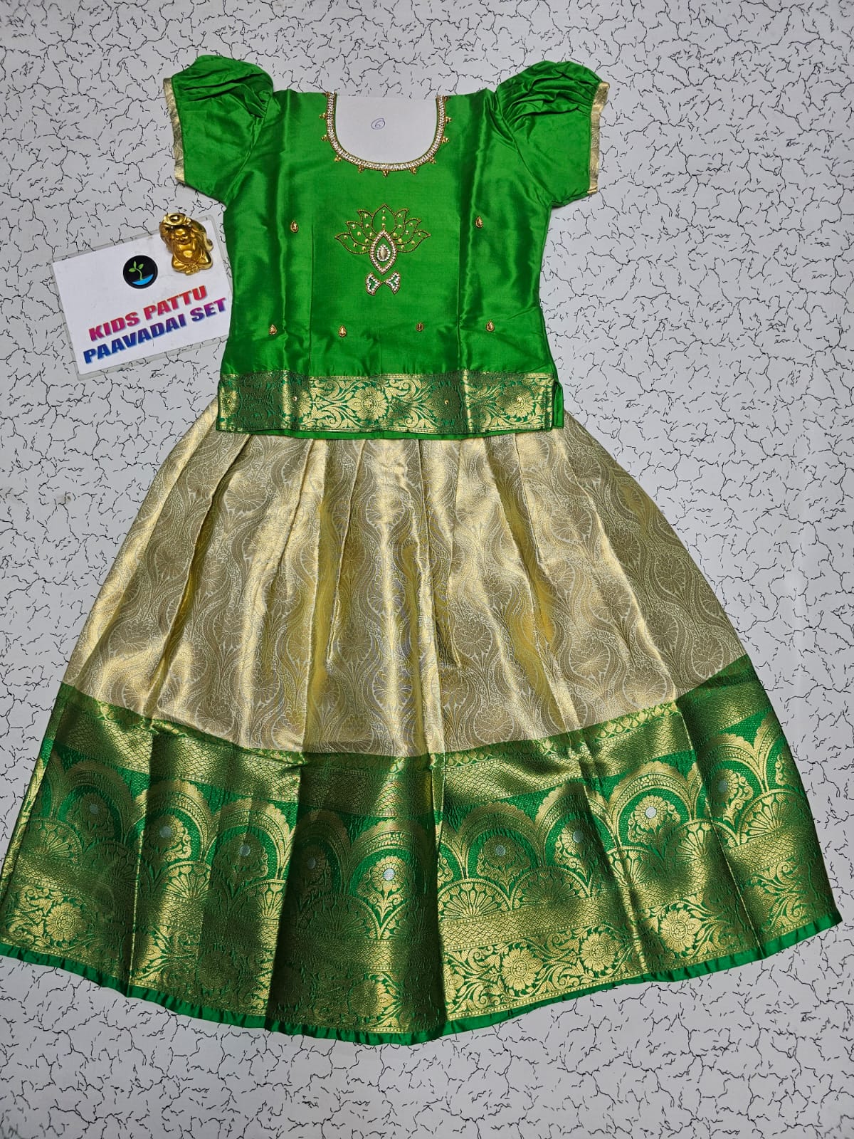 Green and golden Banarasi semi silk pattu pavadai for girls with puff sleeve and rich zari border – Sri Thulir