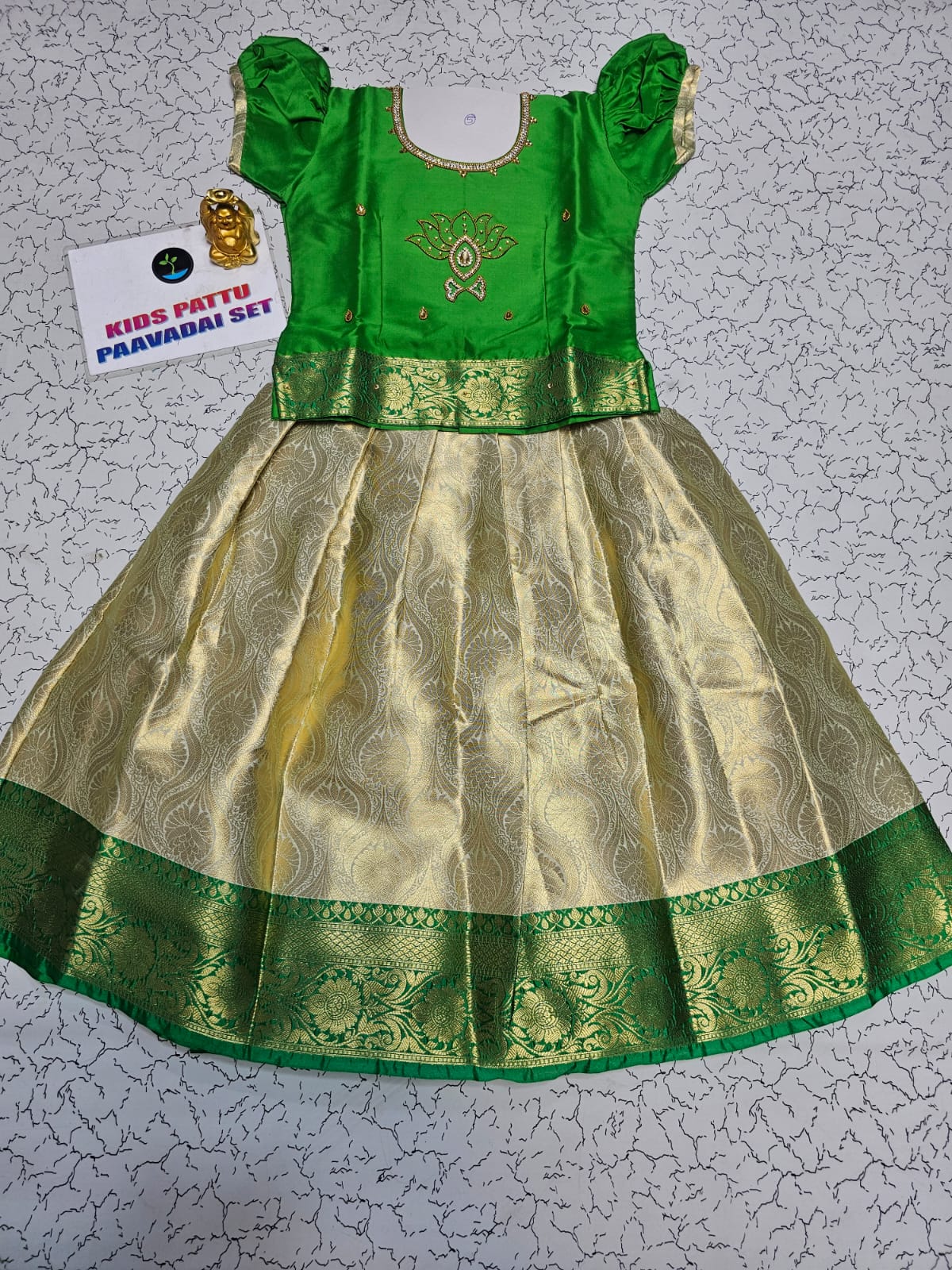 Green and golden Banarasi semi silk pattu pavadai for girls with puff sleeves and elegant zari border – Sri Thulir Tex