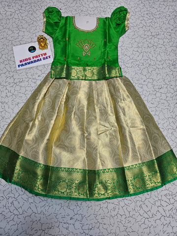 Green and golden Banarasi semi silk pattu pavadai for girls with puff sleeves and elegant zari border – Sri Thulir Tex