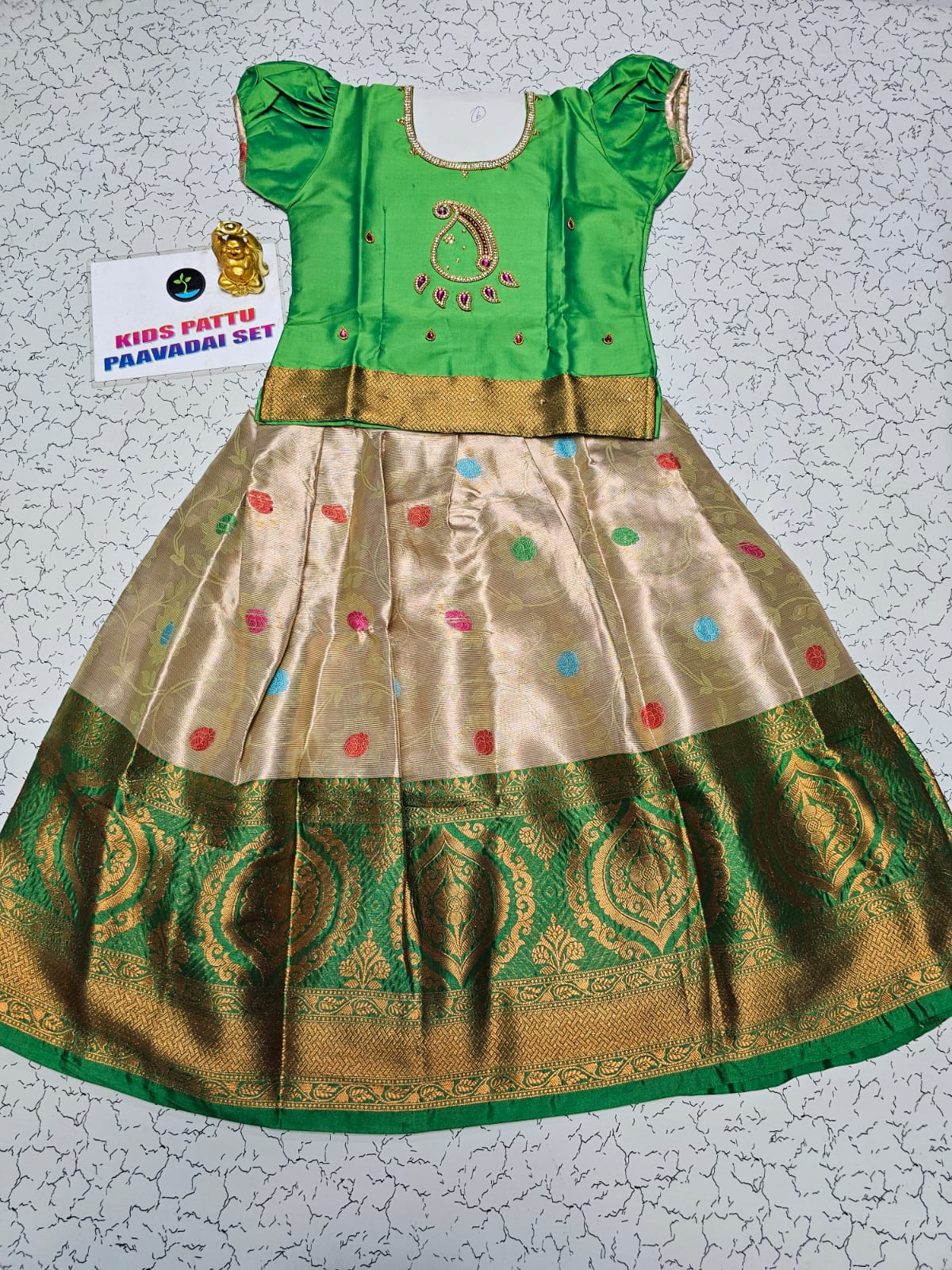 Green and golden Banarasi semi silk pattu pavadai for girls with puff sleeve and rich zari border – Sri Thulir Tex