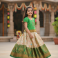 Green and golden Banarasi semi silk pattu pavadai for girls with puff sleeve and rich zari border – Sri Thulir Tex