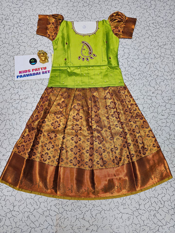 Green and maroon kids pattu pavadai set with puff sleeves and bridal silk skirt by Sri Thulir Tex