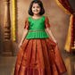Girl wearing green top and maroon bridal silk skirt pattu pavadai – Sri Thulir Tex model photo