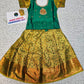 Green and mustard kids pattu pavadai set with puff sleeves and bridal silk skirt by Sri Thulir Tex
