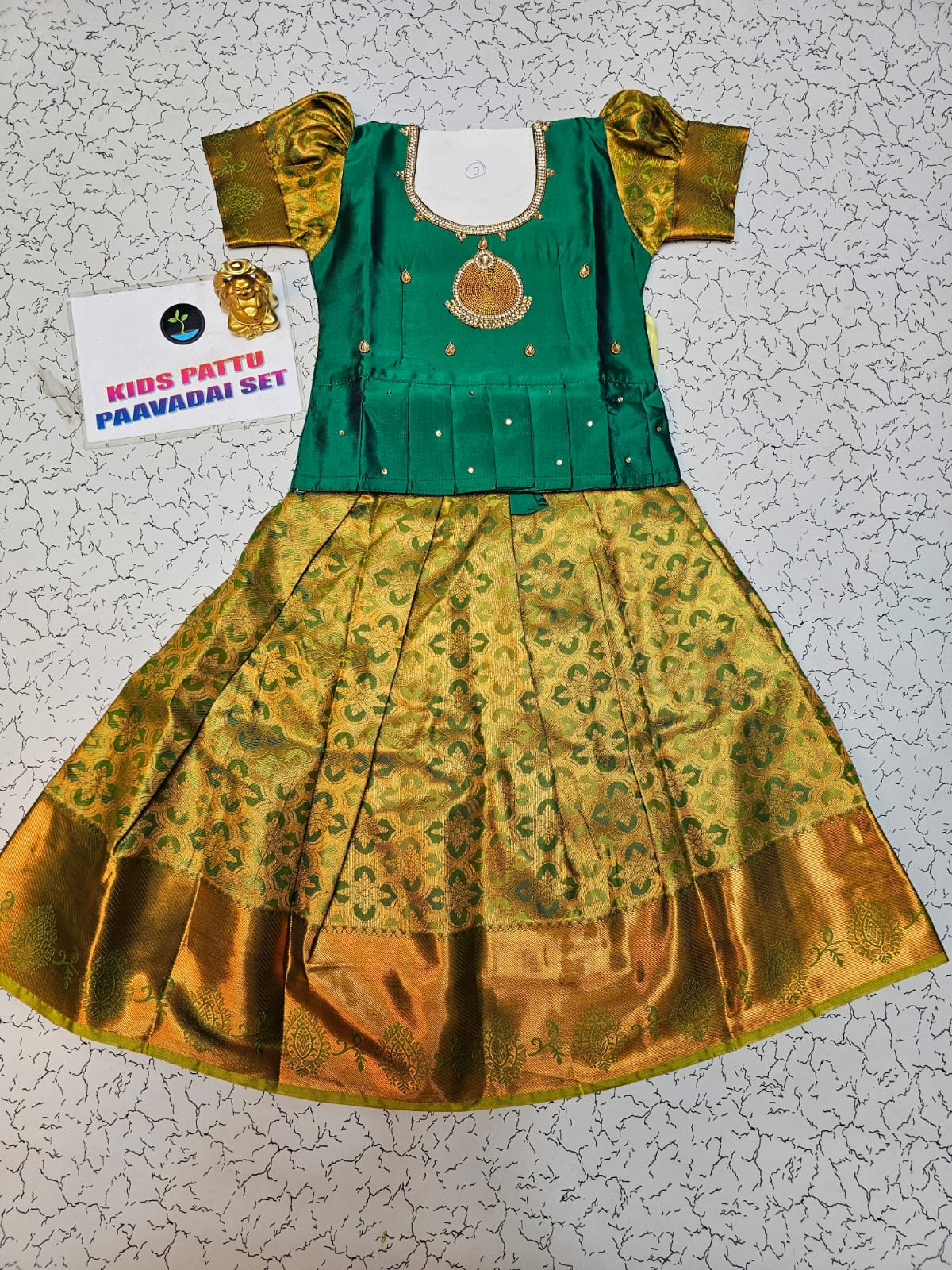 Green and mustard kids pattu pavadai set with puff sleeves and bridal silk skirt by Sri Thulir Tex