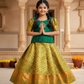 Green and mustard kids pattu pavadai set with puff sleeves and bridal silk skirt by Sri Thulir Tex