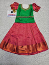 Green and pink kids pattu pavadai set with puff sleeves and bridal silk skirt by Sri Thulir Tex