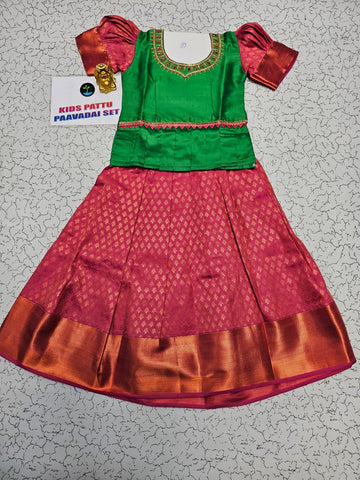 Green and pink kids pattu pavadai set with puff sleeves and bridal silk skirt by Sri Thulir Tex
