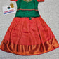 Green and red kids pattu pavadai set with puff sleeves and premium bridal silk skirt by Sri Thulir Tex