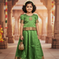 Green semi silk pattu pavadai for girls with puff sleeves and gold zari border – Sri Thulir Tex