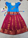 Kids Pattu Pavadai set with blue stone-work top and maroon zari woven skirt from Sri Thulir Tex.