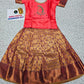 Kids pattu pavadai with coral pink semi-silk top and purple gold bridal silk skirt by Sri Thulir Tex
