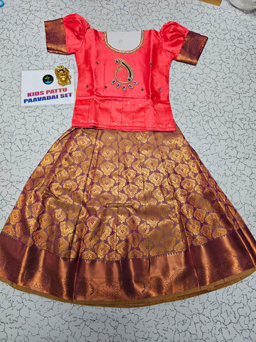 Kids pattu pavadai with coral pink semi-silk top and purple gold bridal silk skirt by Sri Thulir Tex