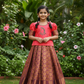 Kids pattu pavadai with coral pink semi-silk top and purple gold bridal silk skirt by Sri Thulir Tex
