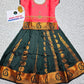 Kids Pattu Pavadai set with coral pink stone-work top and dark green zari woven skirt from Sri Thulir Tex.