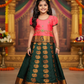 Kids Pattu Pavadai set with coral pink stone-work top and dark green zari woven skirt from Sri Thulir Tex.