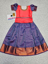 Kids Pattu Pavadai set with coral pink top and royal blue zari woven skirt from Sri Thulir Tex.