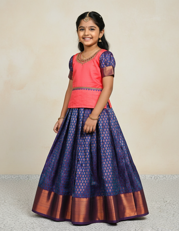 Kids Pattu Pavadai set with coral pink top and royal blue zari woven skirt from Sri Thulir Tex.
